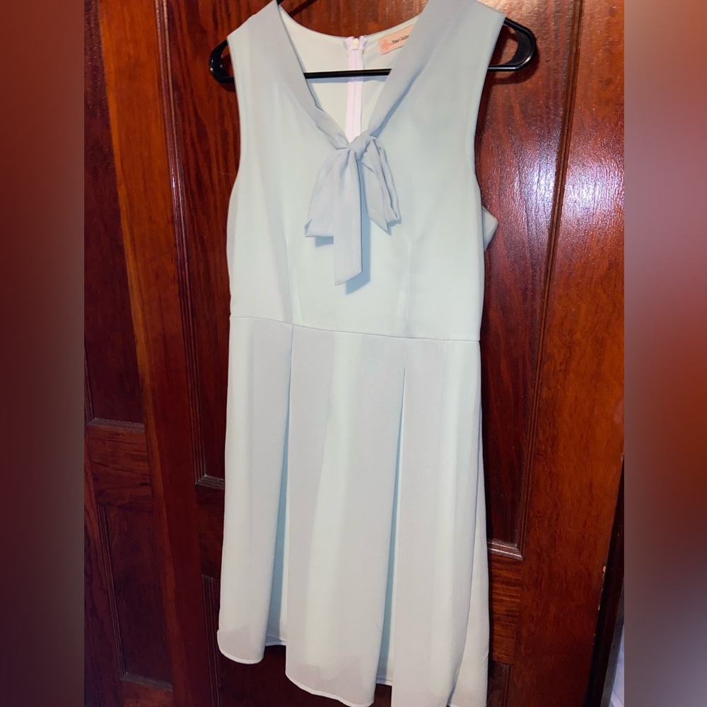 Sage green sleeveless dress with tied neck